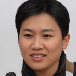 Joyful asian young-adult female with short  brown hair and brown eyes