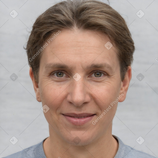 Joyful white adult male with short  brown hair and grey eyes