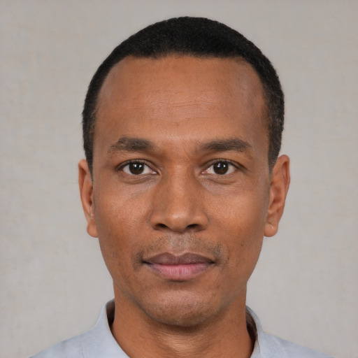 Neutral black young-adult male with short  black hair and brown eyes