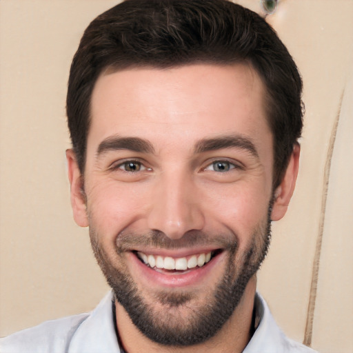 Joyful white young-adult male with short  black hair and brown eyes