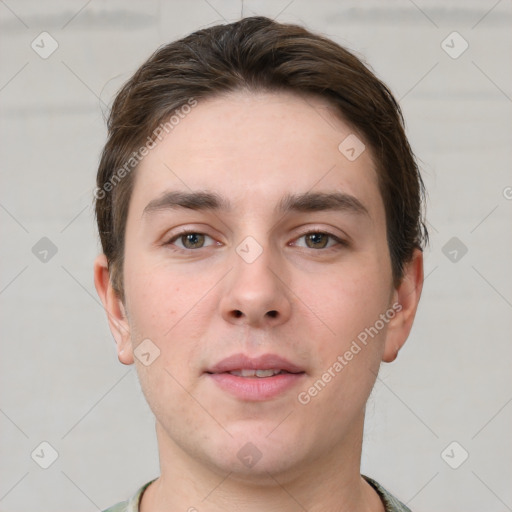 Neutral white young-adult male with short  brown hair and grey eyes