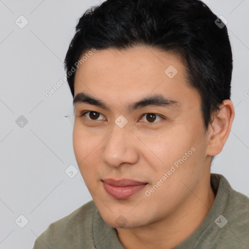 Joyful asian young-adult male with short  black hair and brown eyes