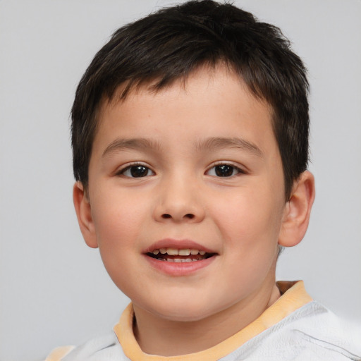 Joyful white child male with short  brown hair and brown eyes