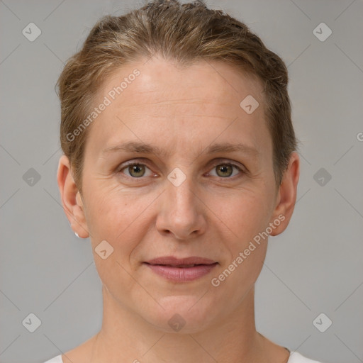 Joyful white adult female with short  brown hair and grey eyes