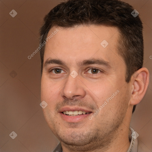 Joyful white adult male with short  brown hair and brown eyes