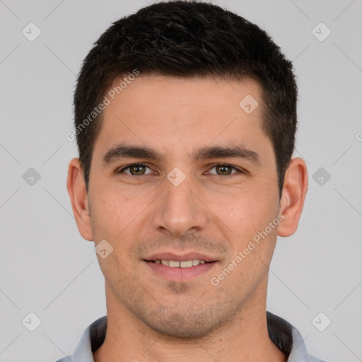 Joyful white young-adult male with short  brown hair and brown eyes