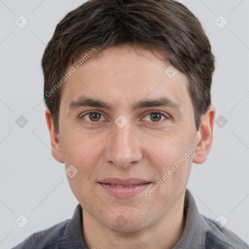 Joyful white adult male with short  brown hair and grey eyes