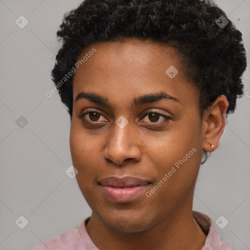 Joyful black young-adult female with short  black hair and brown eyes