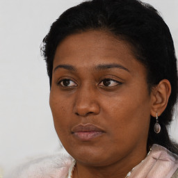 Neutral black young-adult female with short  black hair and brown eyes