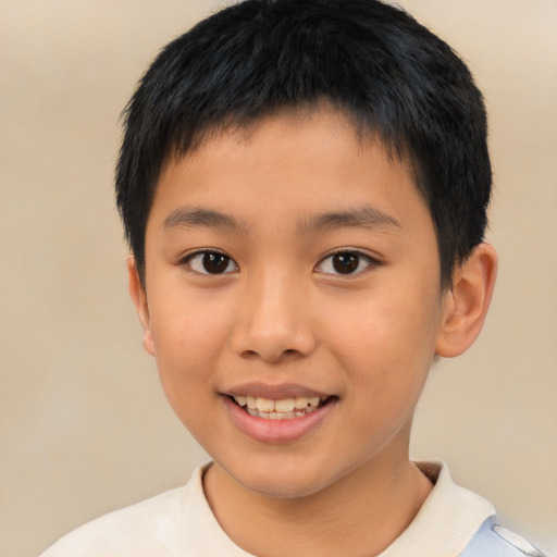 Joyful asian child male with short  brown hair and brown eyes