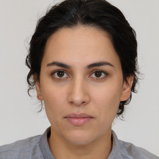 Neutral white young-adult female with medium  brown hair and brown eyes