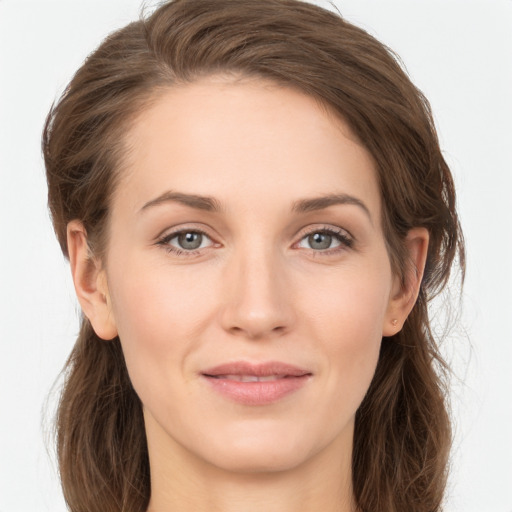 Joyful white young-adult female with long  brown hair and grey eyes