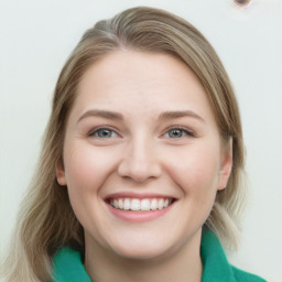 Joyful white young-adult female with medium  brown hair and blue eyes