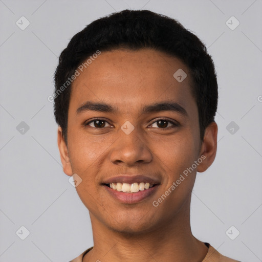 Joyful latino young-adult male with short  black hair and brown eyes