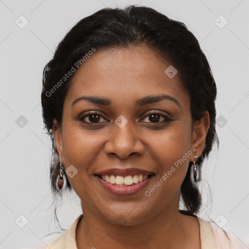 Joyful black young-adult female with medium  brown hair and brown eyes