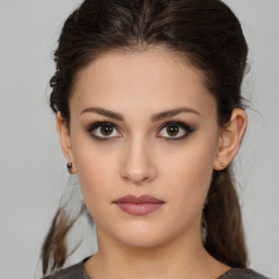 Neutral white young-adult female with medium  brown hair and brown eyes