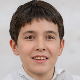 Joyful white child male with short  brown hair and brown eyes