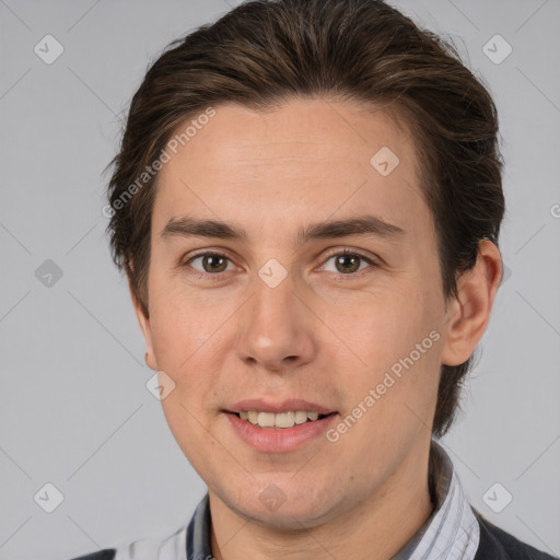 Joyful white adult male with short  brown hair and brown eyes