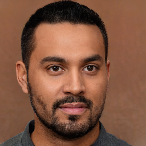 Neutral latino young-adult male with short  black hair and brown eyes