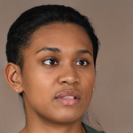 Joyful black young-adult female with short  brown hair and brown eyes