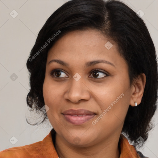 Joyful black adult female with medium  brown hair and brown eyes