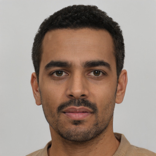 Neutral latino young-adult male with short  black hair and brown eyes