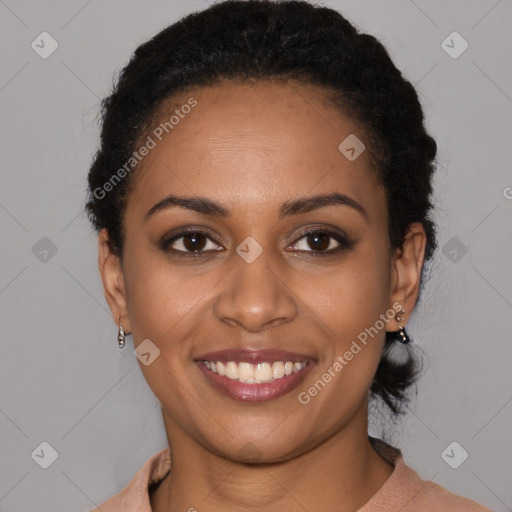 Joyful black young-adult female with medium  brown hair and brown eyes