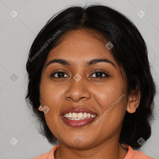 Joyful black young-adult female with medium  brown hair and brown eyes