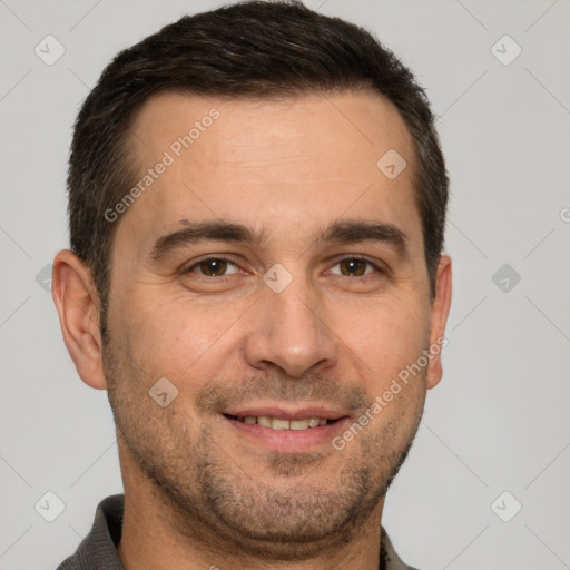 Joyful white adult male with short  brown hair and brown eyes