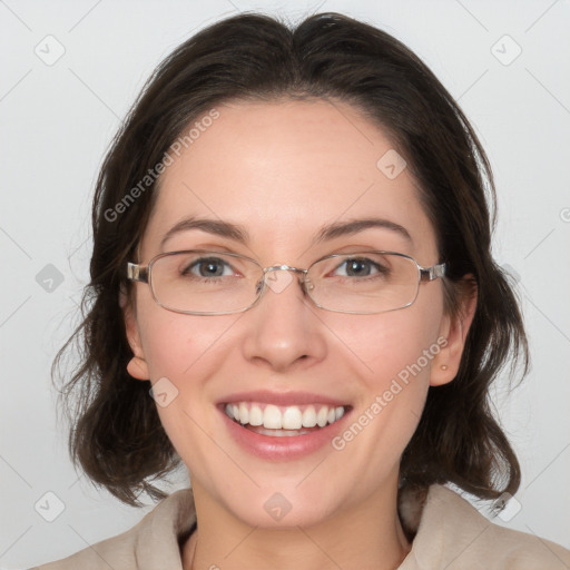 Joyful white adult female with medium  brown hair and grey eyes