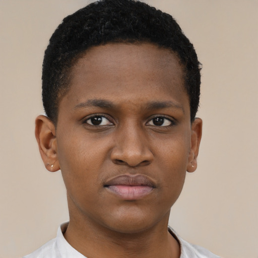 Joyful black young-adult male with short  brown hair and brown eyes
