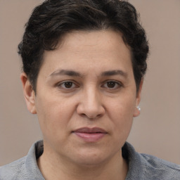 Joyful white adult female with short  brown hair and brown eyes