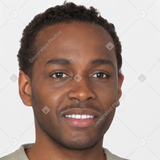 Joyful black young-adult male with short  brown hair and brown eyes