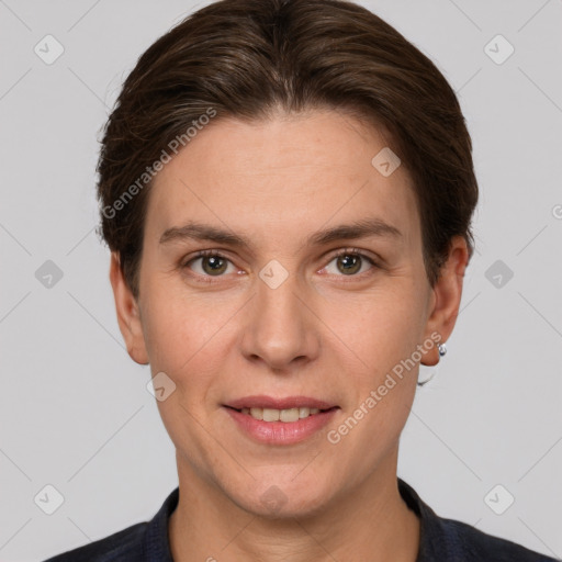 Joyful white adult female with short  brown hair and grey eyes