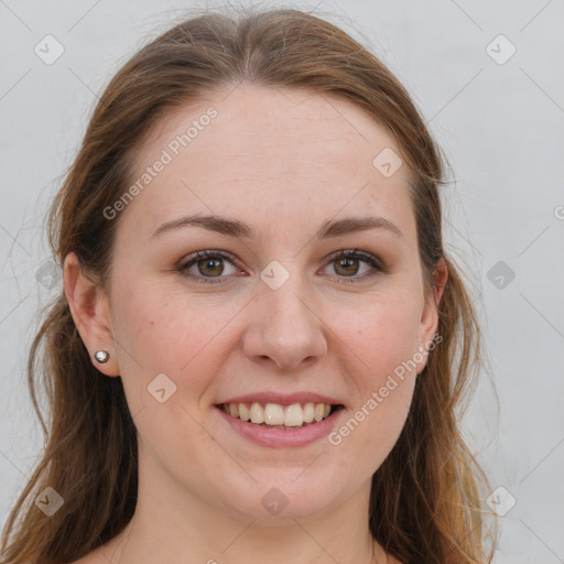 Joyful white young-adult female with long  brown hair and blue eyes