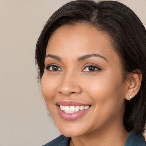 Joyful white young-adult female with medium  brown hair and brown eyes