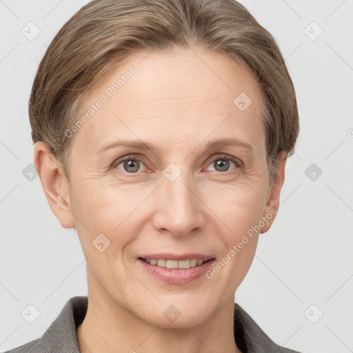 Joyful white adult female with short  brown hair and grey eyes