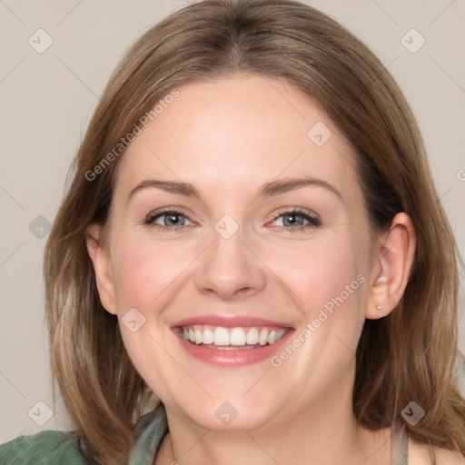 Joyful white adult female with medium  brown hair and grey eyes