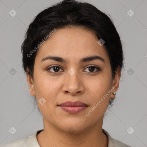 Joyful latino young-adult female with short  brown hair and brown eyes