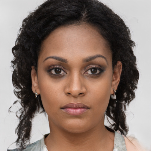 Neutral black young-adult female with long  brown hair and brown eyes