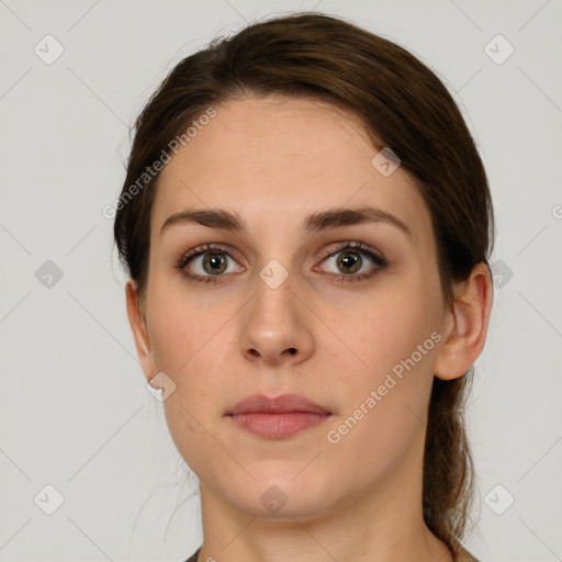 Neutral white young-adult female with medium  brown hair and grey eyes