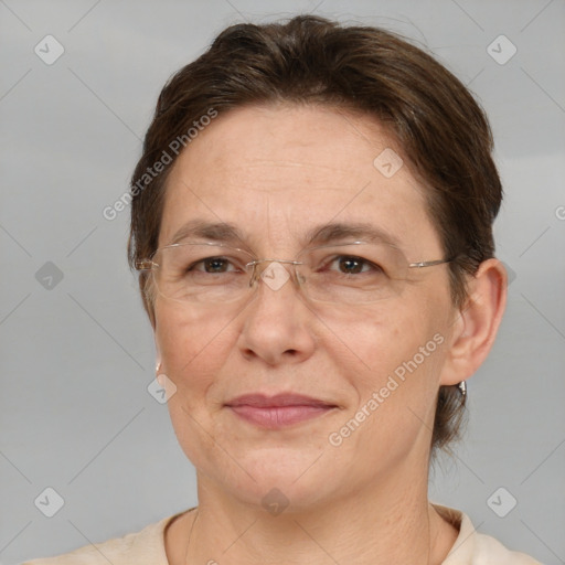 Joyful white adult female with short  brown hair and brown eyes