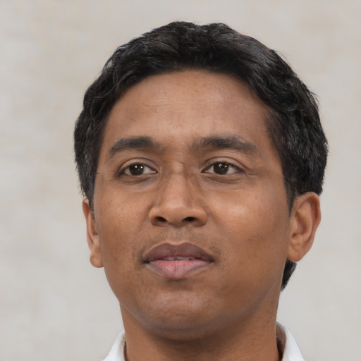 Neutral black adult male with short  black hair and brown eyes
