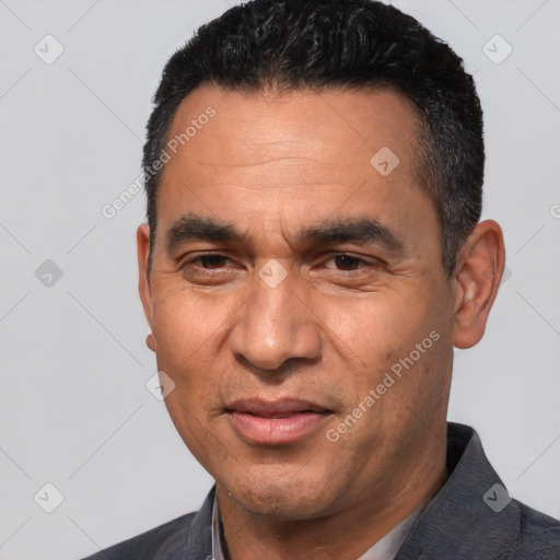 Joyful white adult male with short  black hair and brown eyes