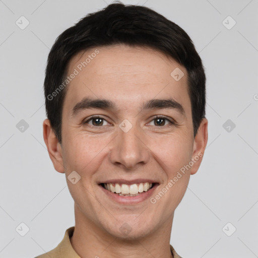 Joyful white young-adult male with short  brown hair and brown eyes