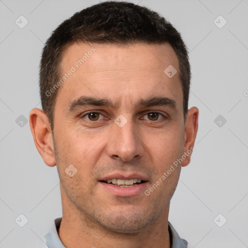 Joyful white adult male with short  brown hair and brown eyes