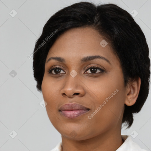 Joyful black young-adult female with medium  brown hair and brown eyes