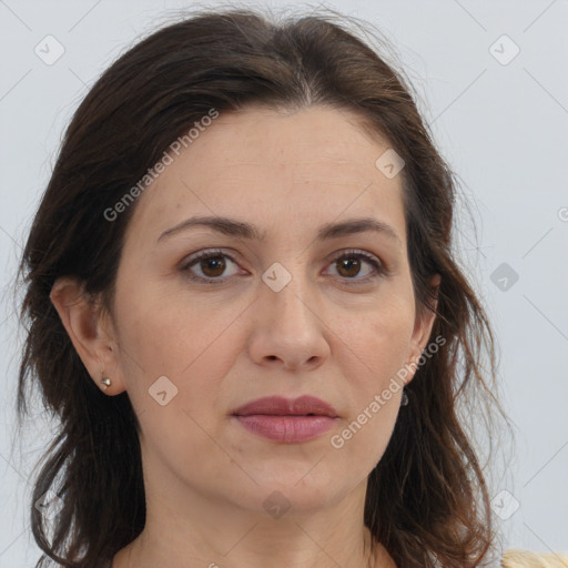 Joyful white adult female with long  brown hair and brown eyes