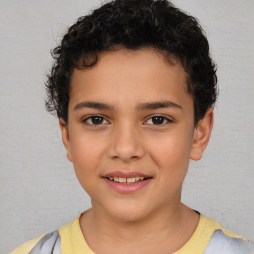 Joyful white child male with short  brown hair and brown eyes