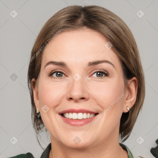 Joyful white young-adult female with medium  brown hair and green eyes